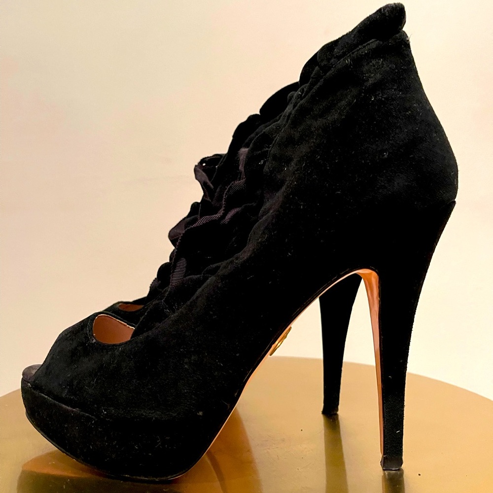 BETSEY JOHNSON Suede lace up platform booties.